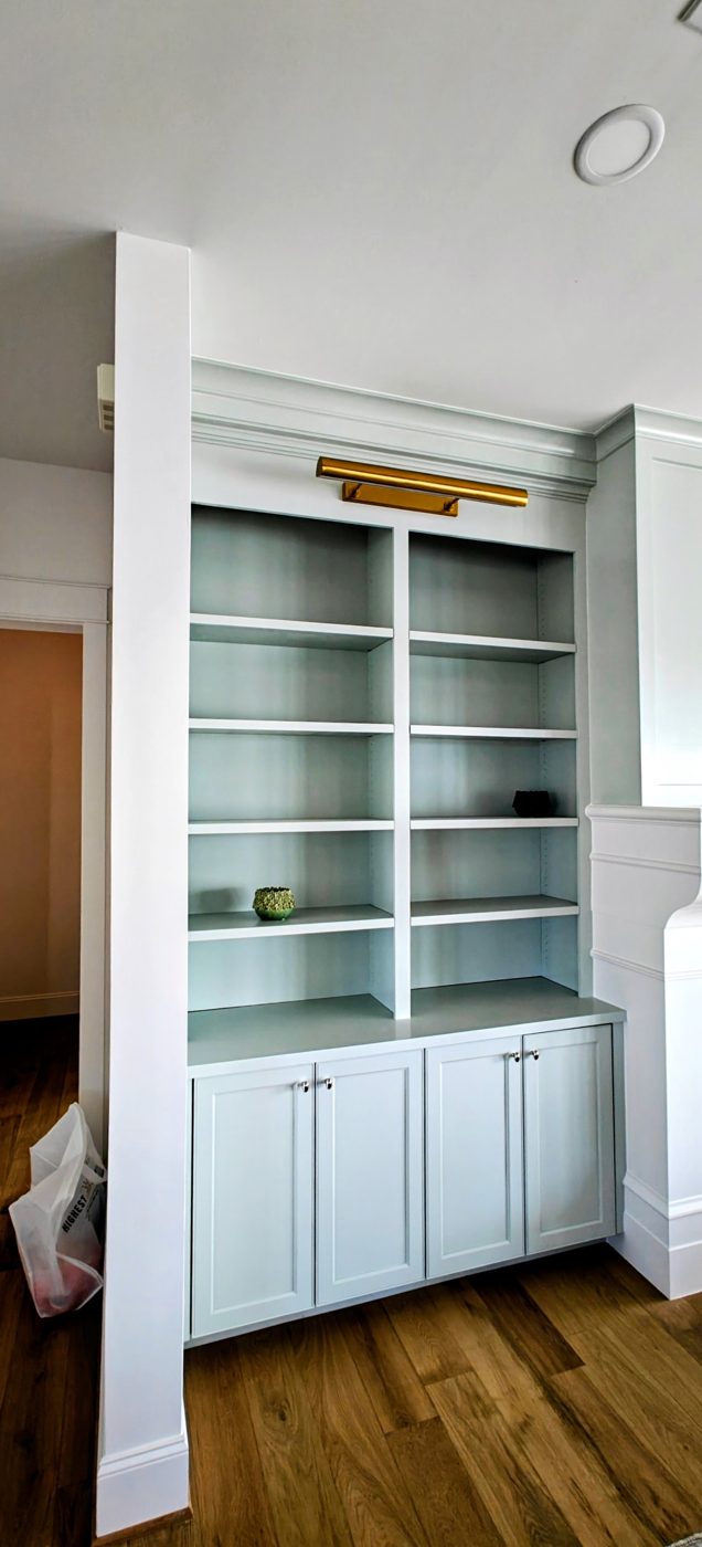 Painted built-in shelving and cabinets